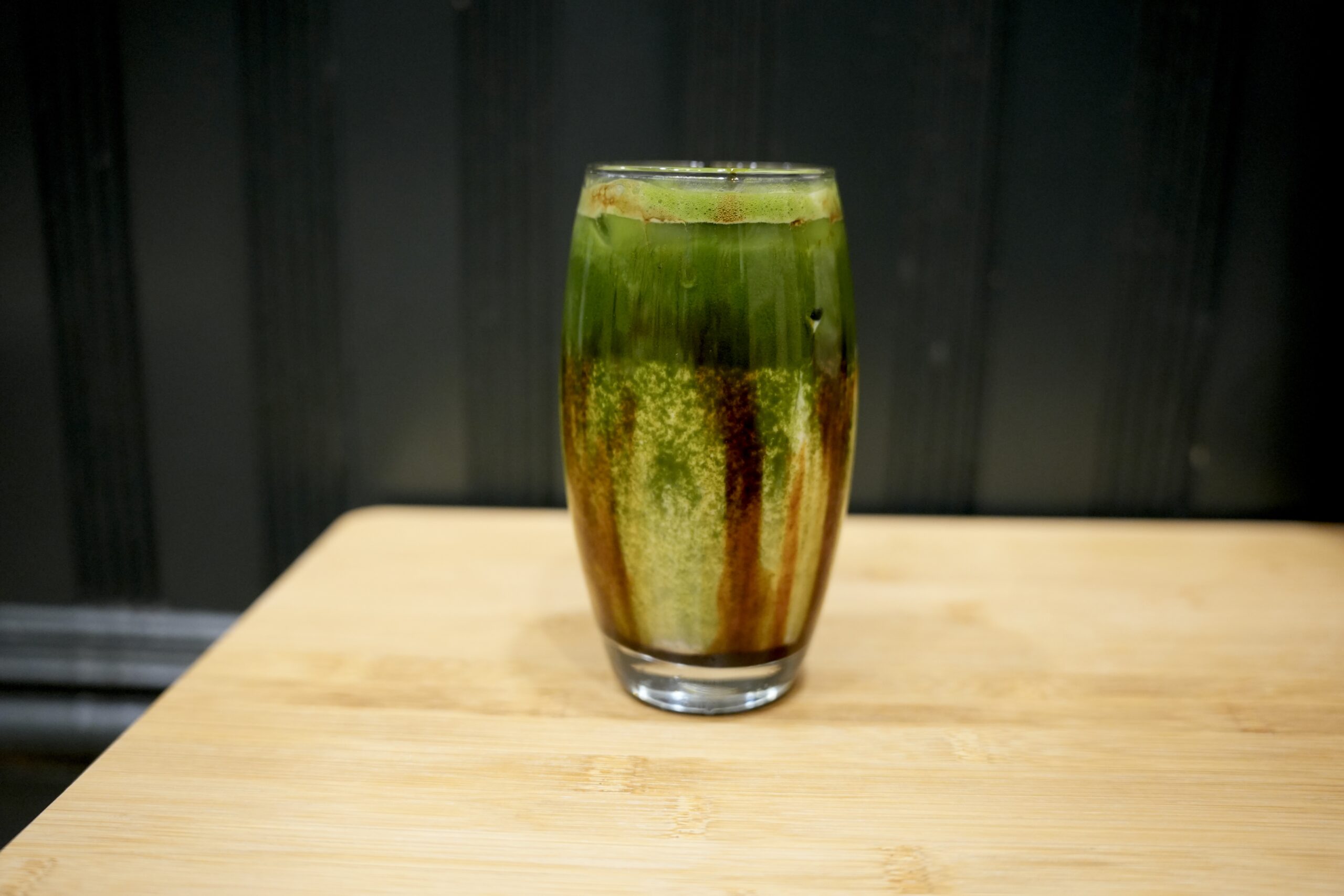 Layered brown sugar matcha drink in glass