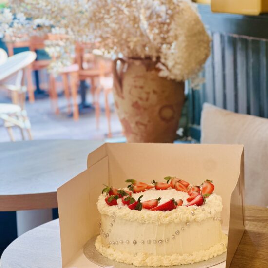 Birthday celebration cake with fresh cream and strawberries by Neeko