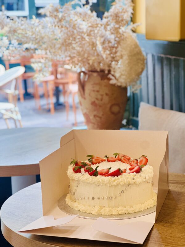 Birthday celebration cake with fresh cream and strawberries by Neeko